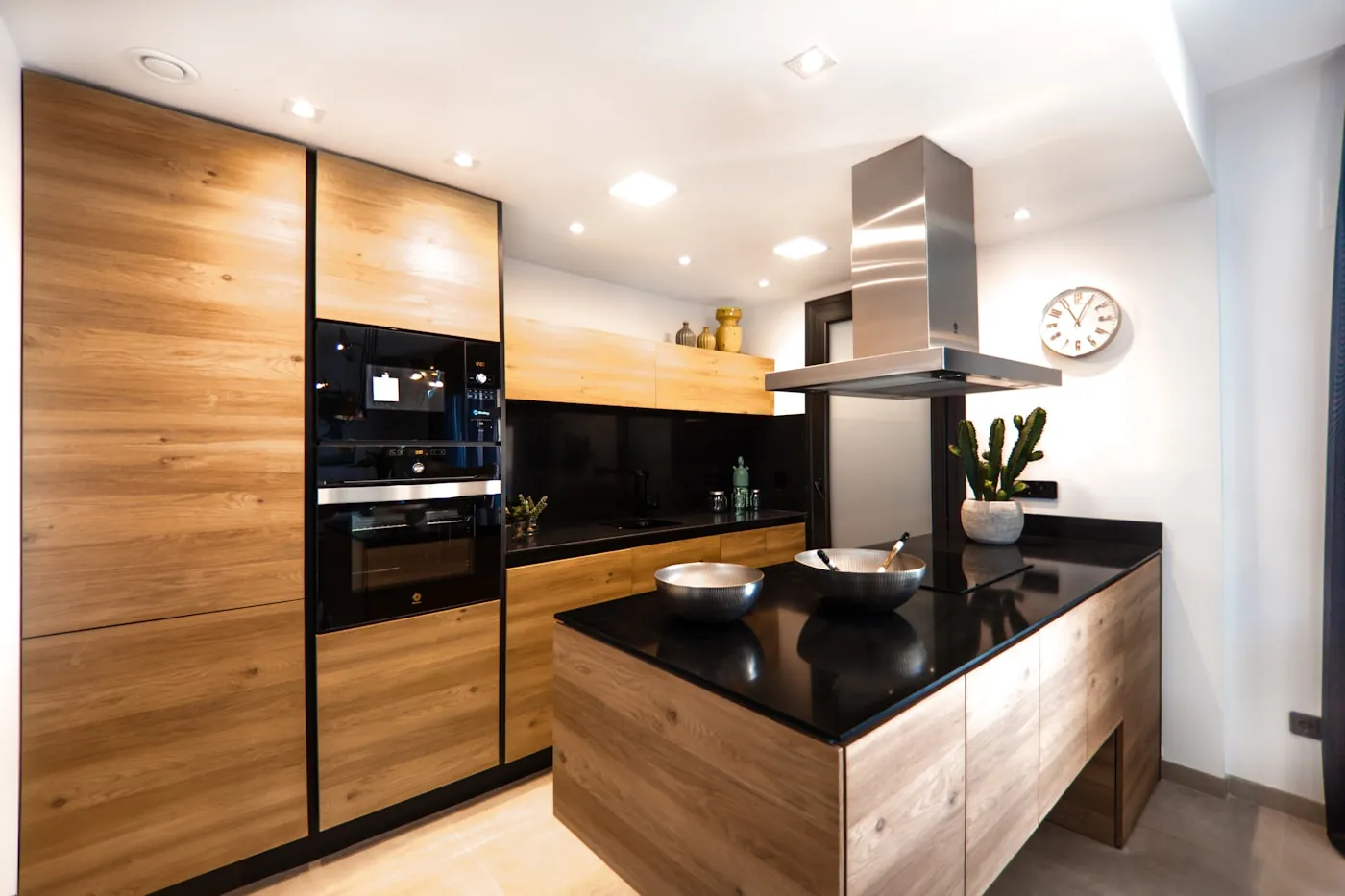 Warm timber kitchen with a black granite island