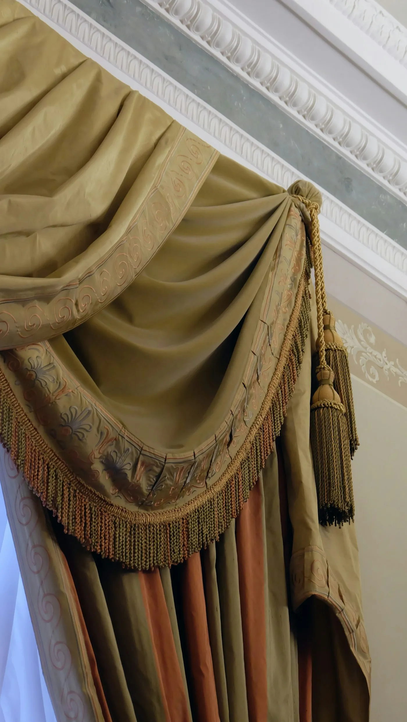 Golden velvet curtain glowing in the evening light